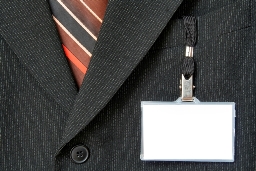professional wearing suit with work badge