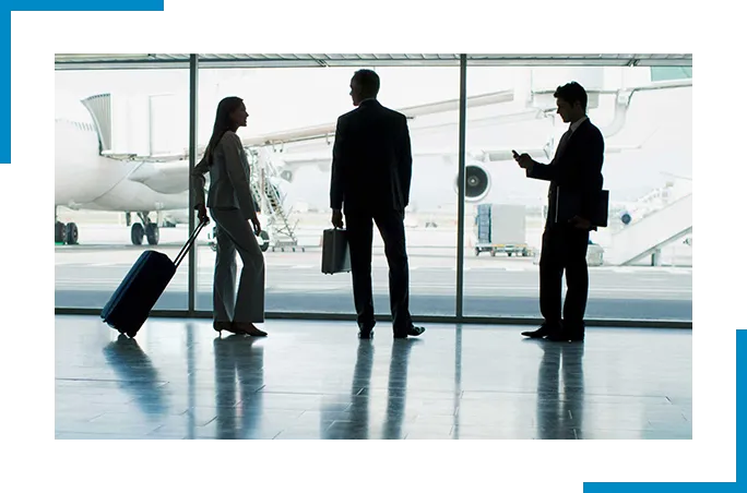 3 people standing at the airport