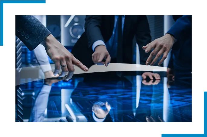 3 peoples hands pointing to a screen