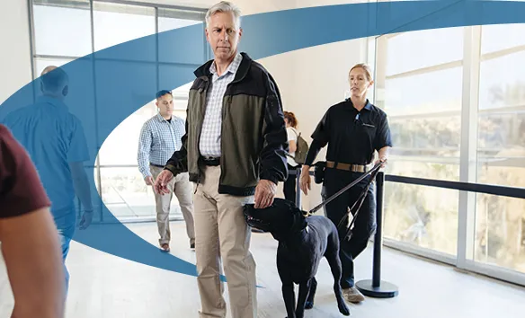 Allied Universal Security guard with canine